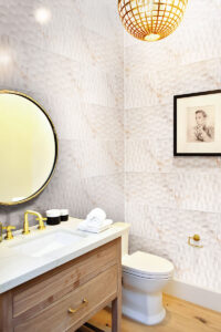 Adella Viso Calacatta 12×24 Satin Wall styled in a finished room