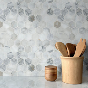 Calacatta Cressa 2” Hexagon Mosaic styled in a finished room