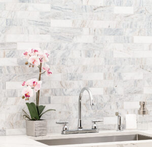 Capri Blue Honed Subway Tile 2×6 styled in a finished room