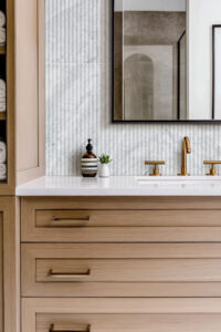 Carrara White Milano Ribbo 12×24 Honed styled in a finished room