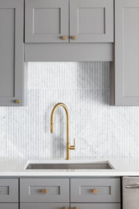 Carrara White Valentino Fluto 12×24 Honed styled in a finished room