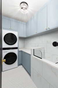 Dymo Calacatta White 12×24 Glossy styled in a finished room