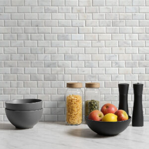 Greecian White Beveled Subway Tile 2×4 styled in a finished room