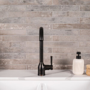Brickstone Taupe Brick 2×18 styled in a finished room