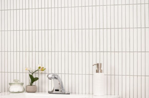 White Matte 1×6 Stack Pattern styled in a finished room